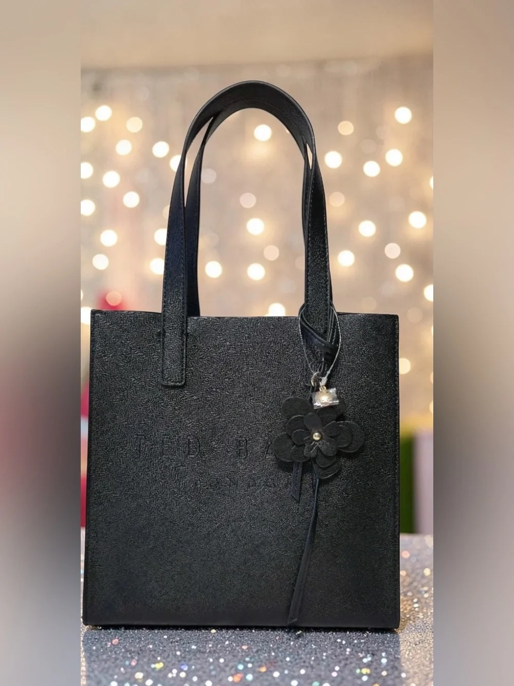 Ted Baker The Icon Black Tote Bag Flower Charm Embossed Logo Double
Handles NWT - Picture 1 of 6